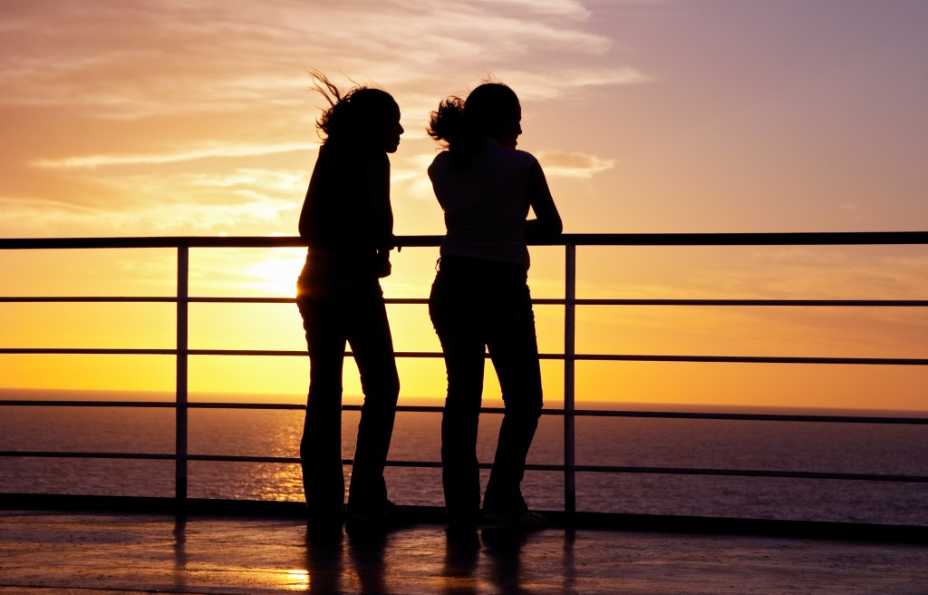 two girls black silhouette and red sunset